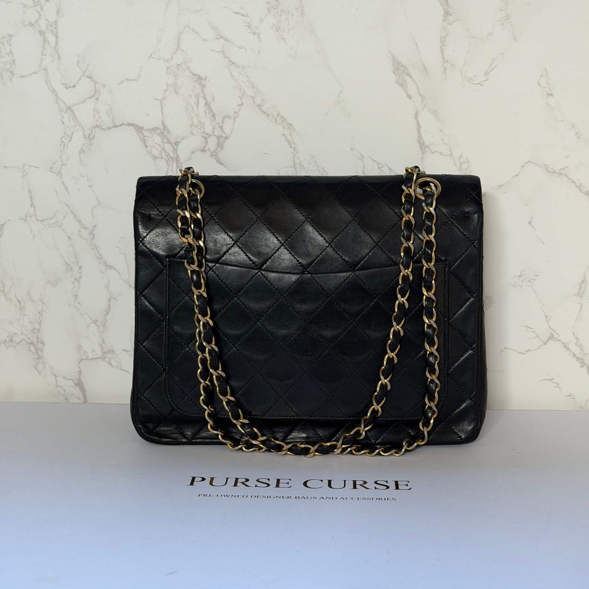 Chanel “Mona Lisa” back pocket (rear pocket detail)