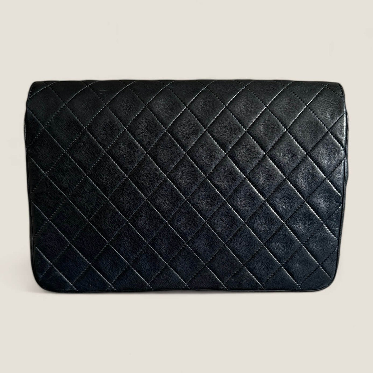 Chanel pre-loved shoulder bag with gold hardware in dark blue lambskin