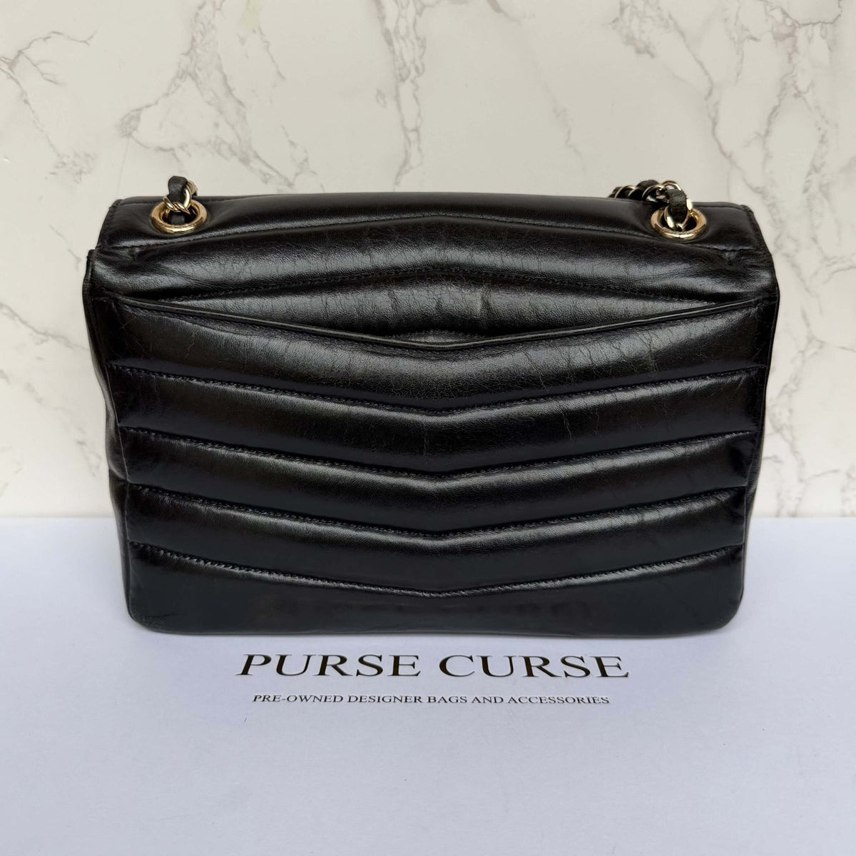 Chanel shiny calfskin flap bag zwart achterkant