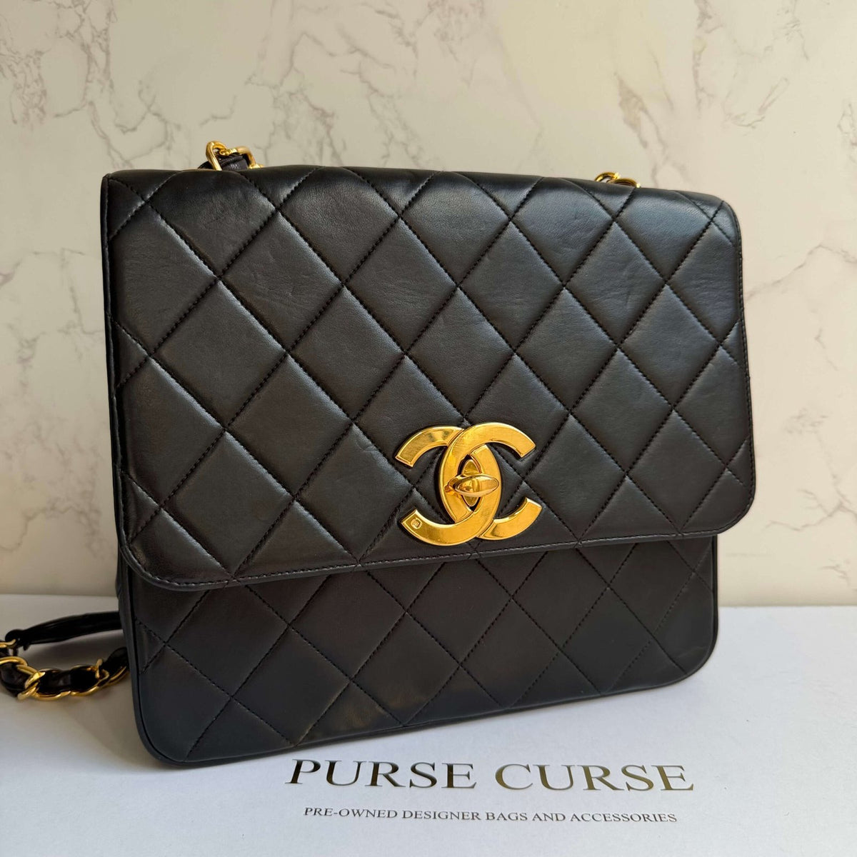 Chanel vintage flap bag large CC logo black front view