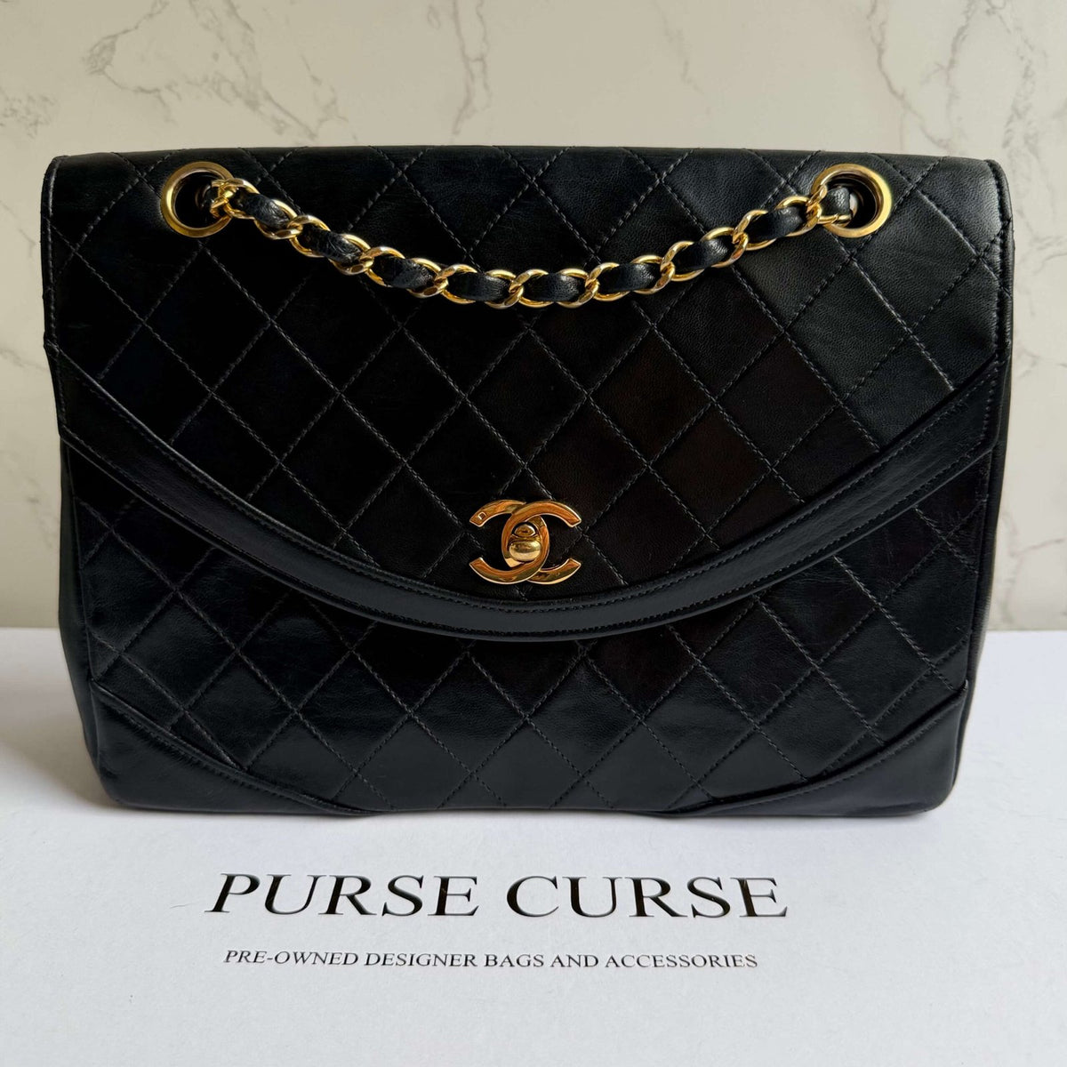 Chanel vintage bag black lambskin with gold chain strap