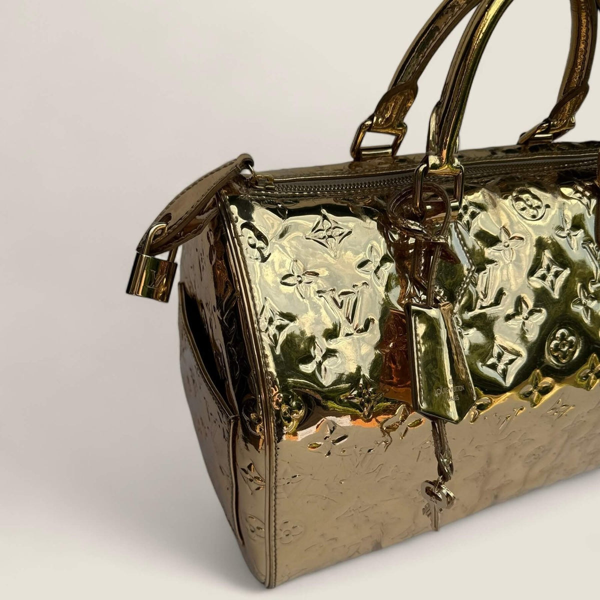 Gold Louis Vuitton bag