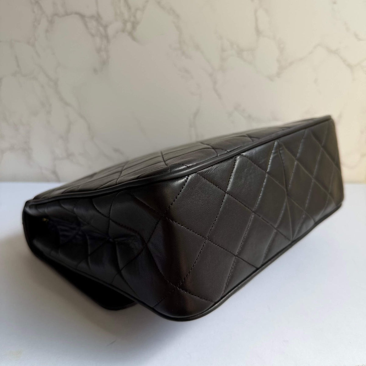 Corners of authentic pre-owned Chanel bag