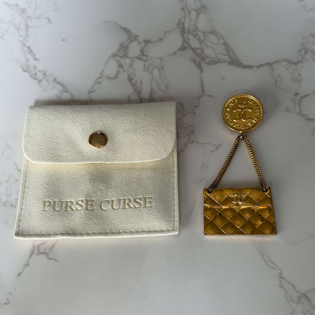 Purse Curse vintage brooch Chanel