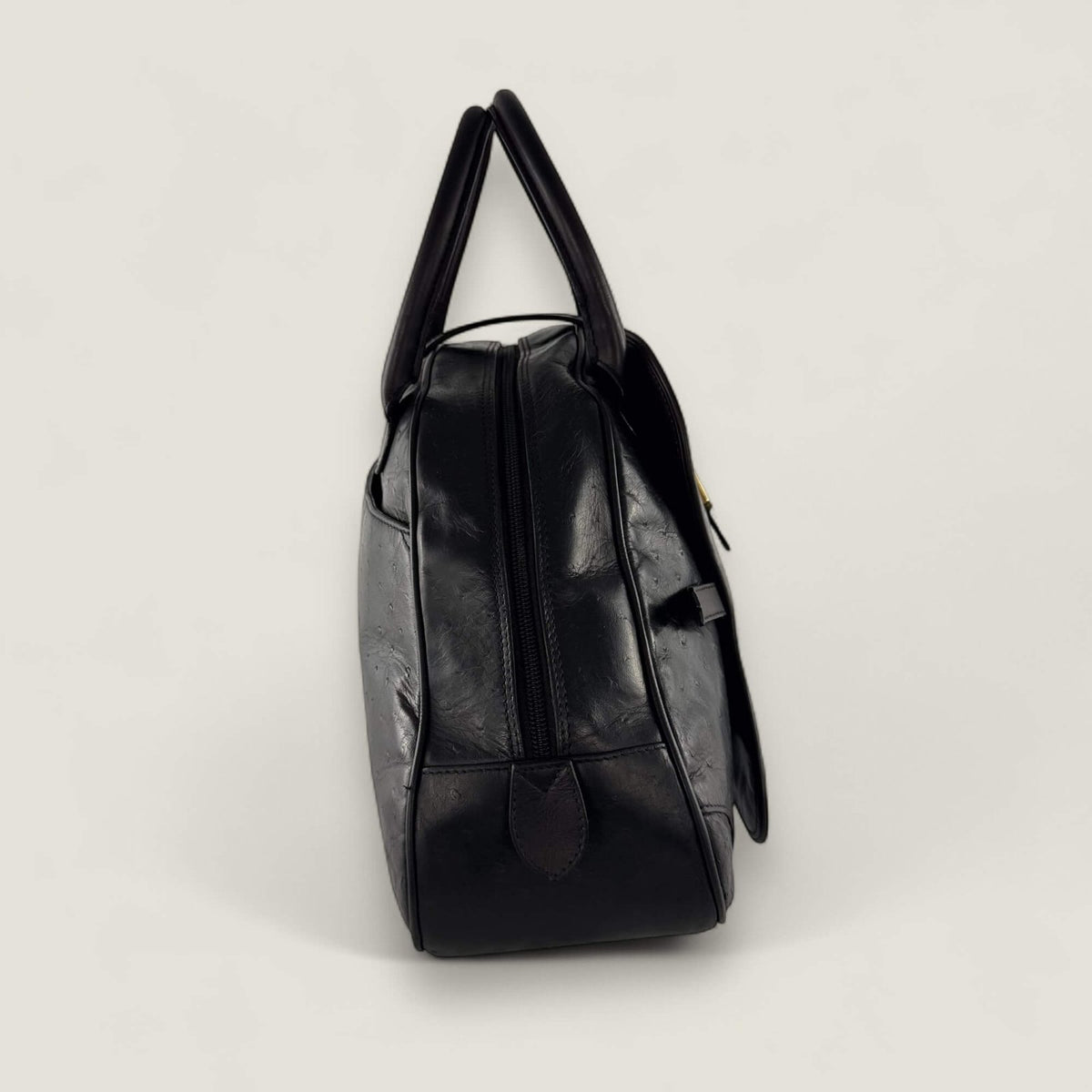 Zijkant tweedehands Dior saddle handtas