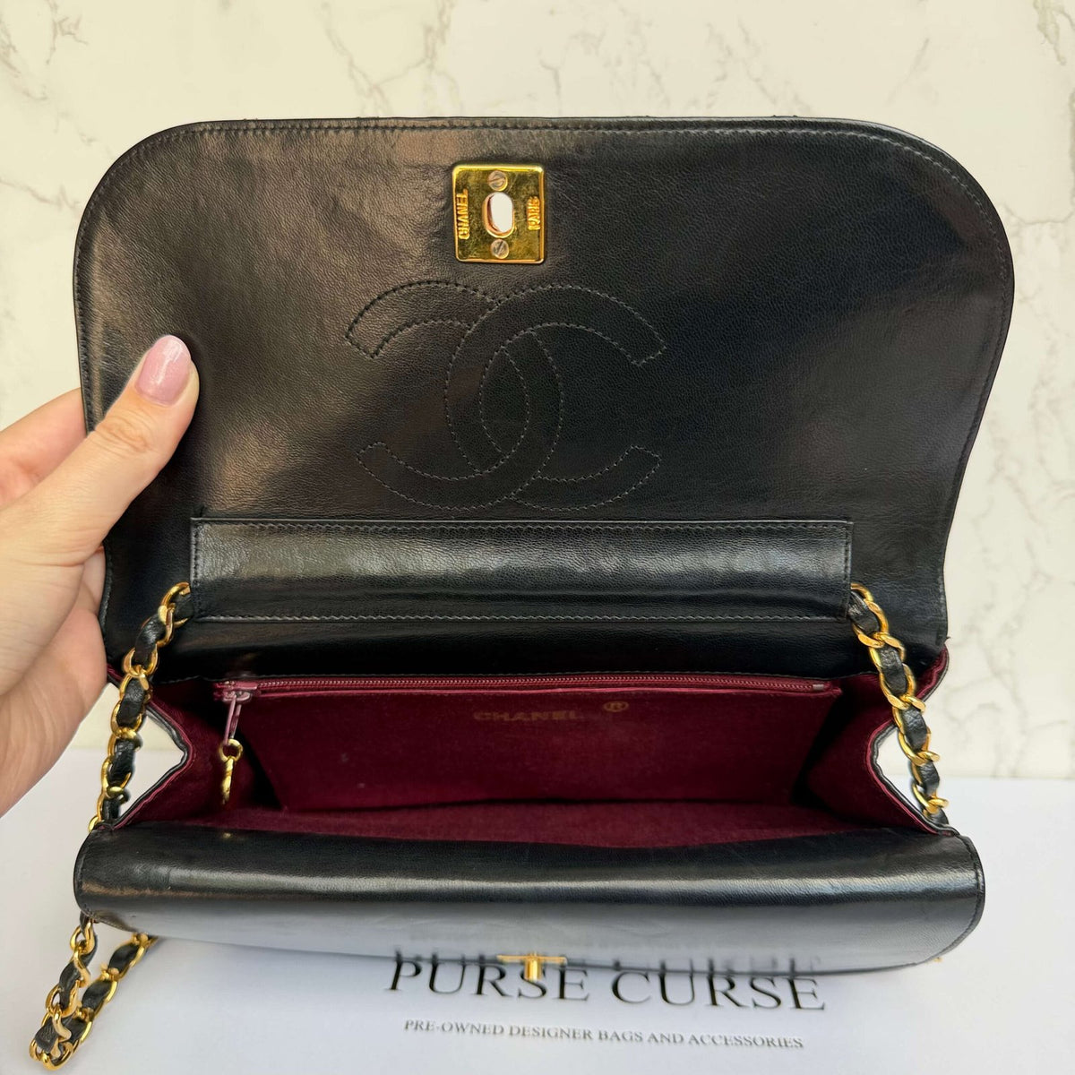 Interior of Chanel half moon double flap in black lambskin