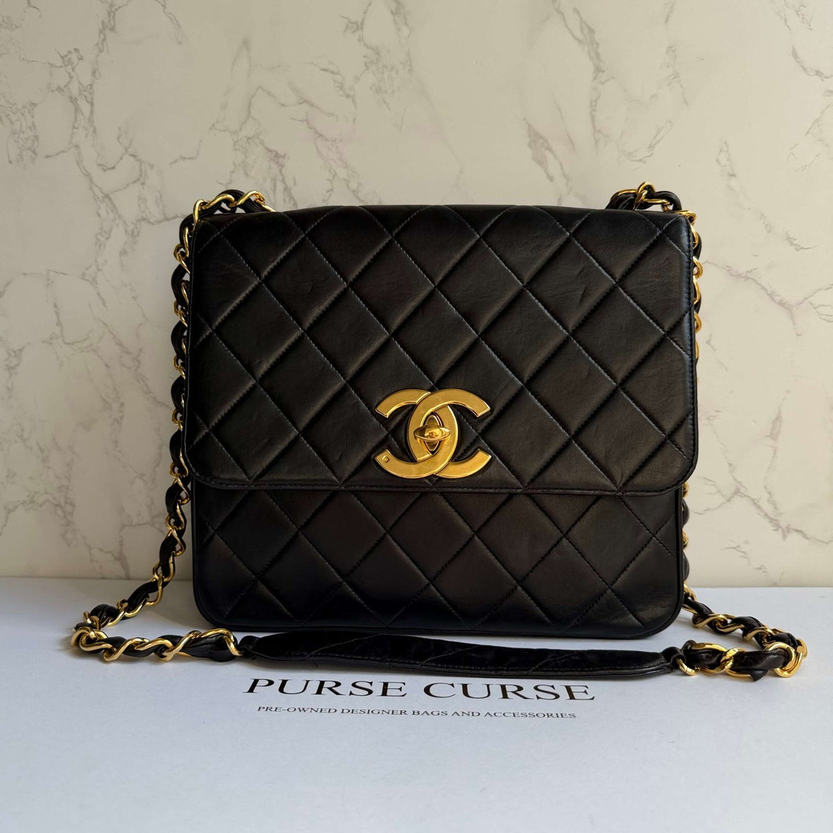 Chanel vintage flap bag black lambskin leather large CC logo