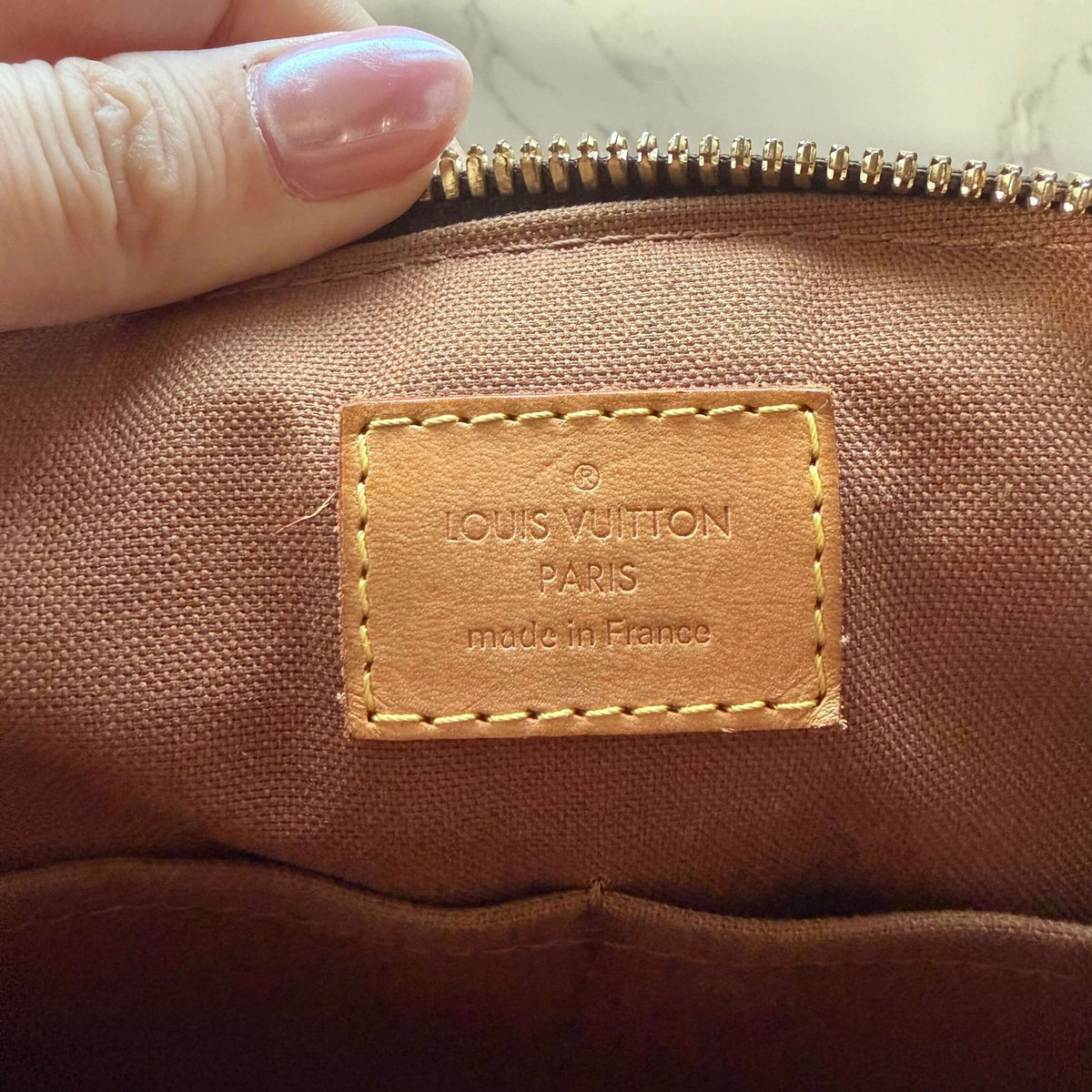 Date code binnenzijde Louis Vuitton Tivoli PM