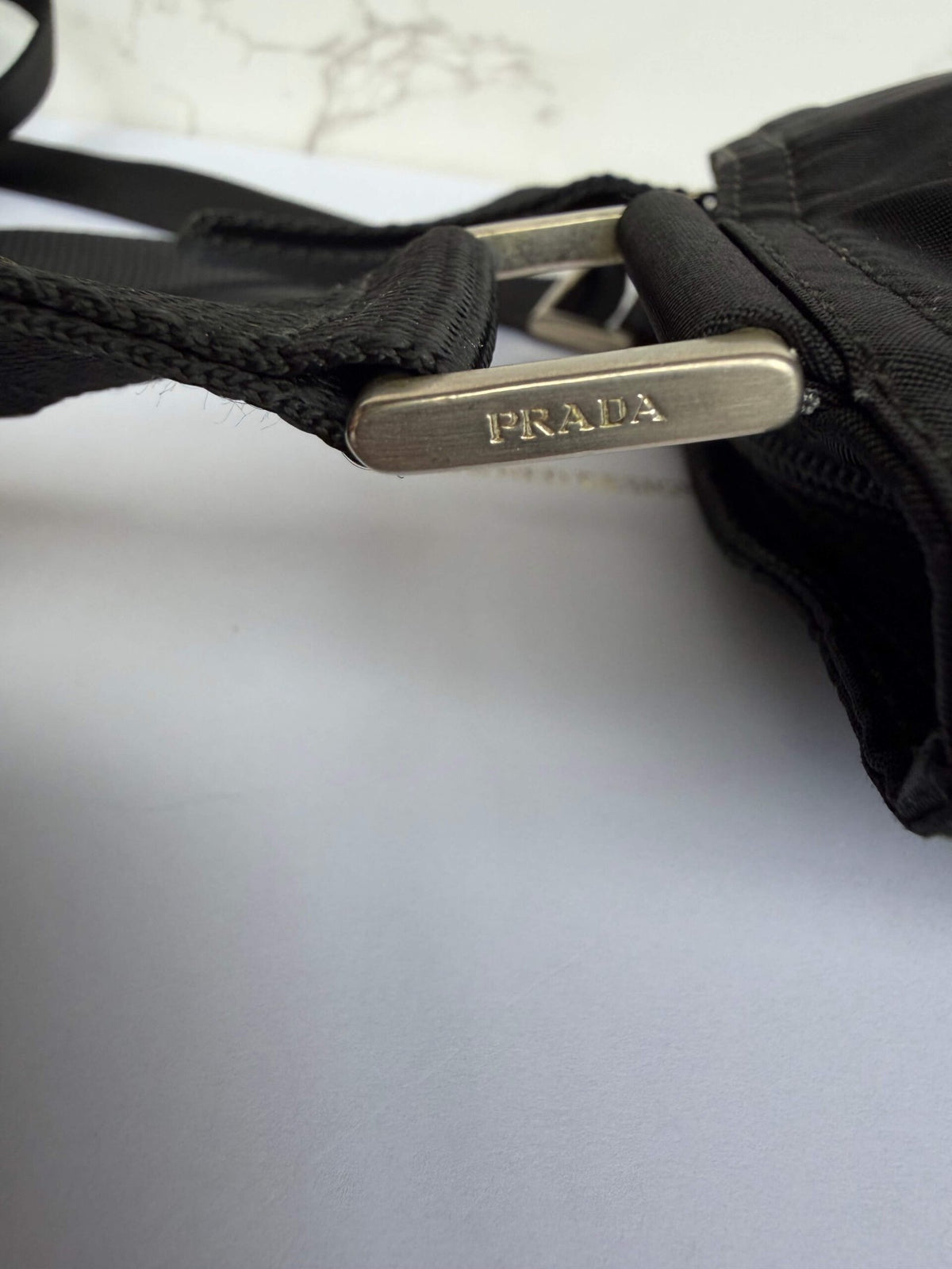 Detail hardware mini Prada schoudertas nylon zwart